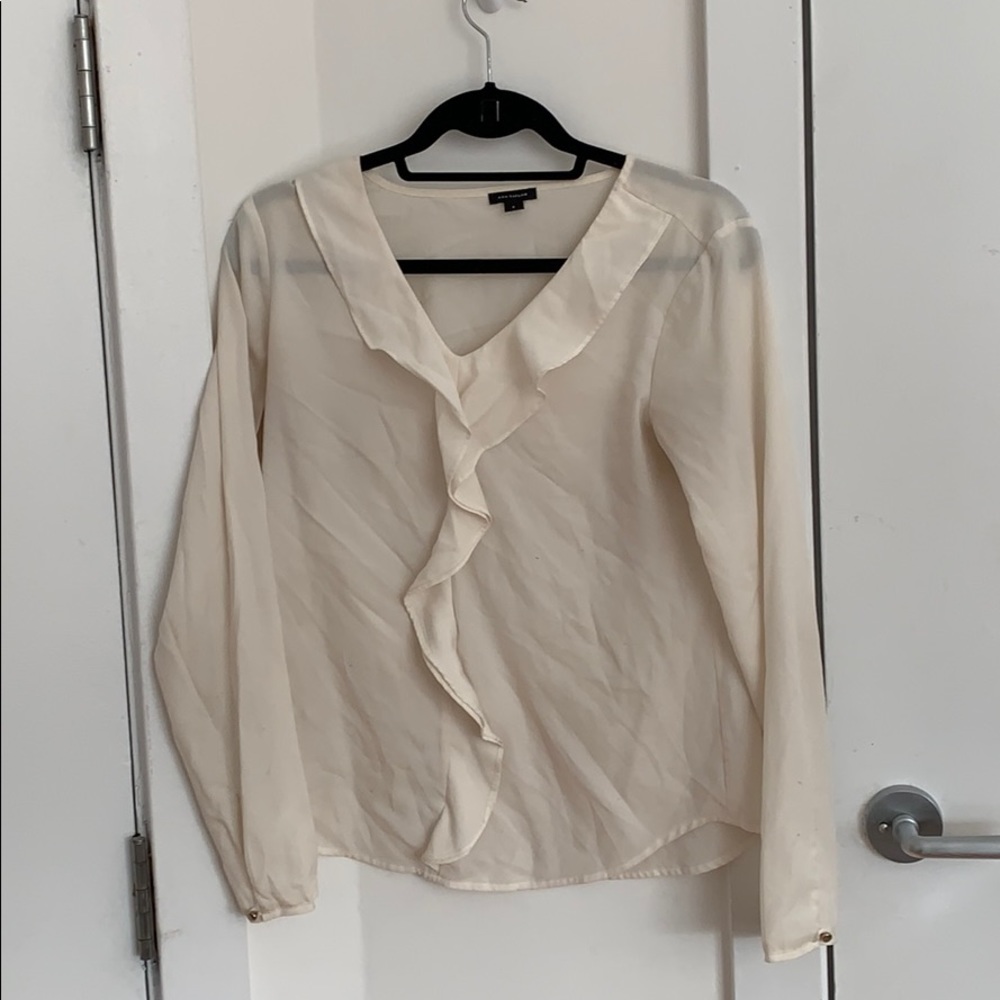 Ann Taylor cream blouse with ruffle detail